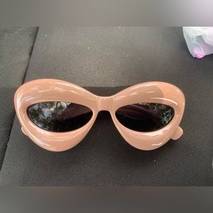 Shades has a light pinkish tan color
